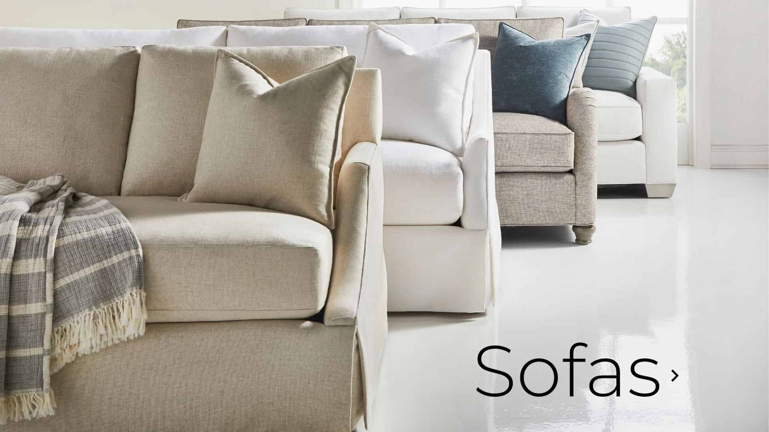 Four vanguard sofas in a white room. Links to sofas page